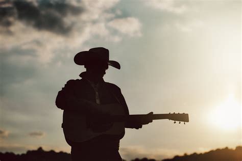 how-long-to-become-good-at-playing-zach-top-songs person playing guitar Zach Top songs