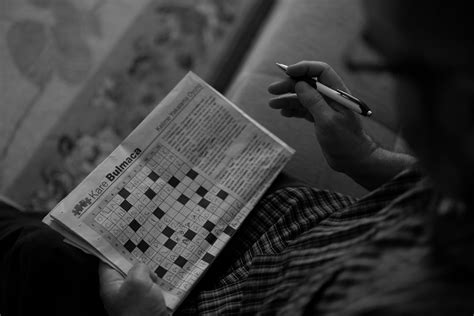 person solving word puzzle