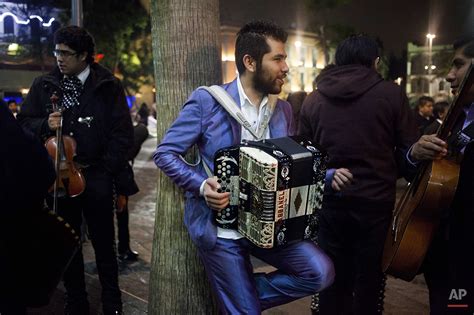 how-long-to-become-proficient-playing-grupo-frontera-music musician playing Norteño accordion