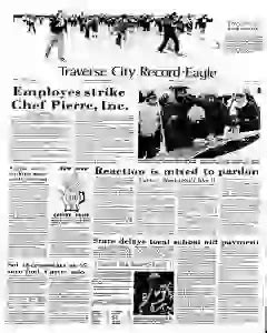 reading local newspaper Traverse City