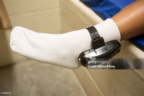 how-long-to-get-accustomed-to-ice-ankle-monitor person wearing ankle monitor