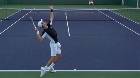 how-long-to-learn-basic-tennis-skills-like-ben-shelton tennis player practicing serves