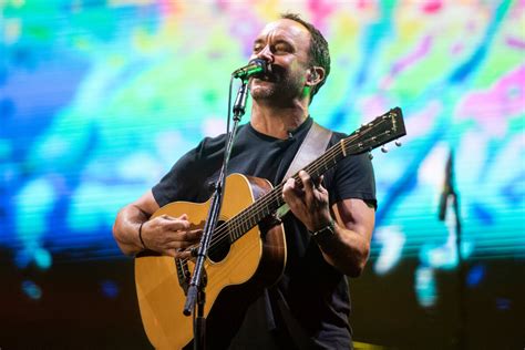 person playing Dave Matthews songs on guitar