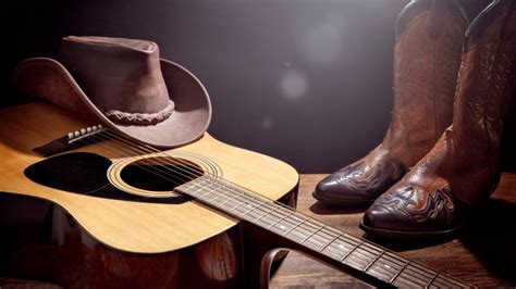 person playing guitar country music