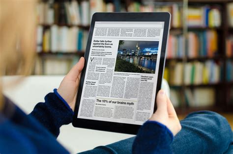 person reading news on KSL