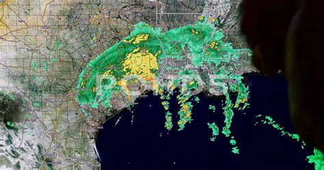 meteorologist analyzing NYC weather maps