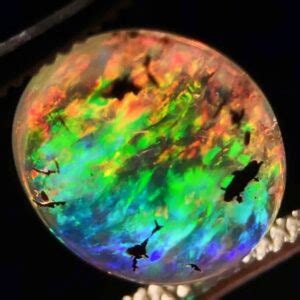 gemologist examining opal gemstone