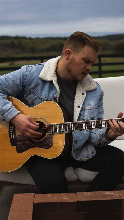 country musician playing guitar