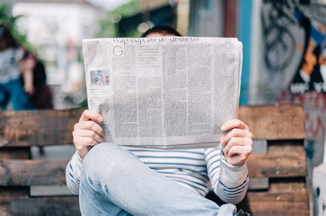 person reading newspaper