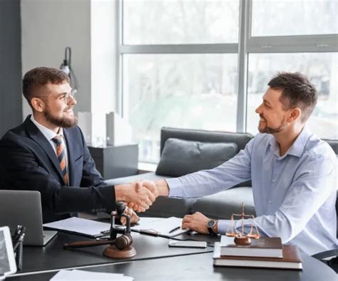 how-long-to-settle-car-accident-case car accident attorney meeting client
